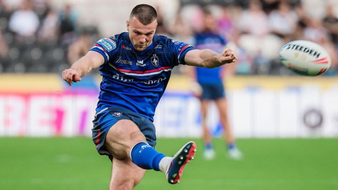 Wakefield Trinity's Max Jowitt kicking for goal.