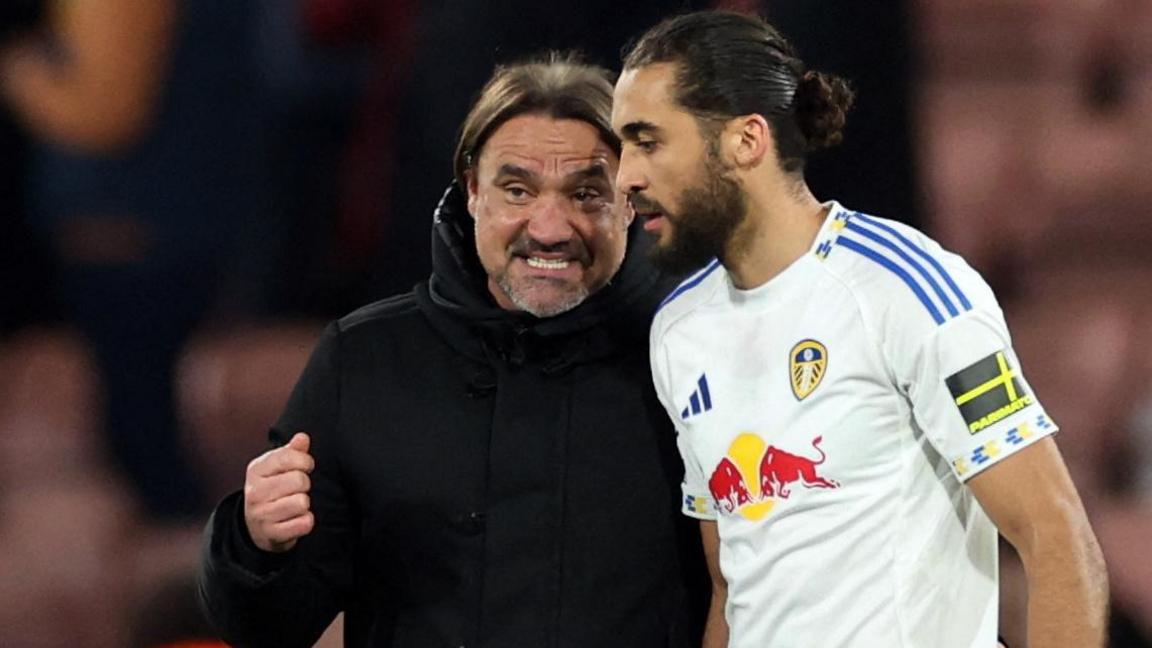 Leeds United manager Daniel Farke speaks with Dominic Calvert-Lewin