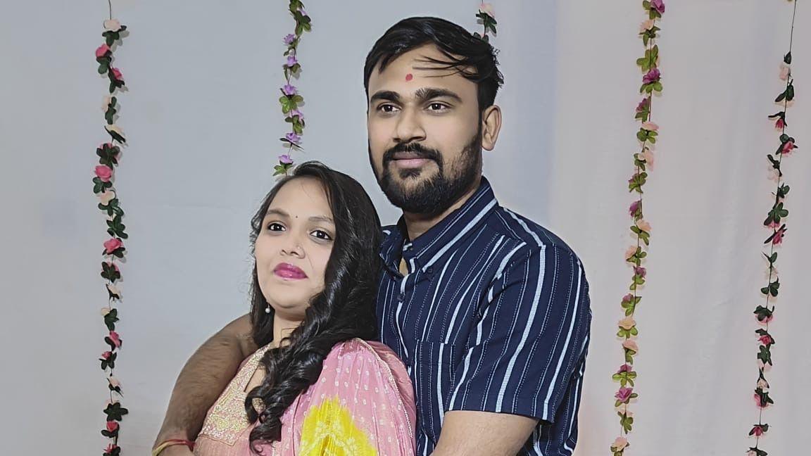 Hardik Avaiya with Vibhooti Patel looking at the camera