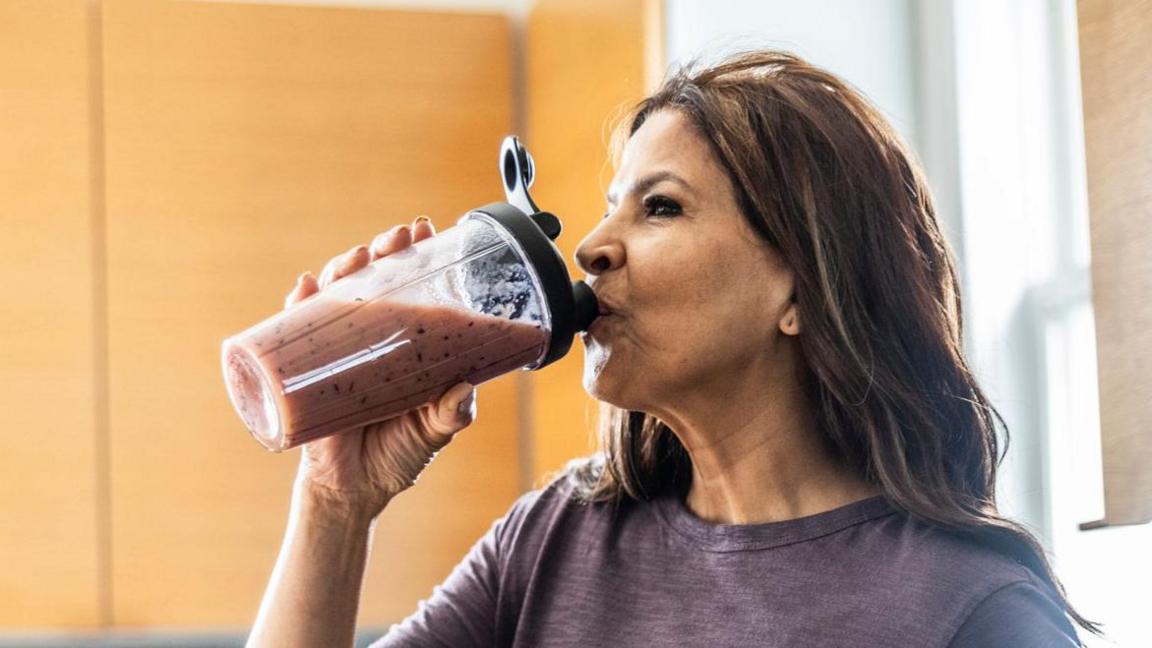 Woman drinking a shake