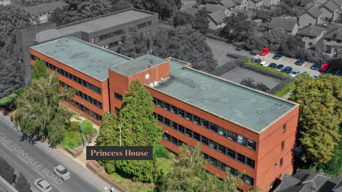 An artist's conception of what the building could look like, with parking spaces at the back of the building.