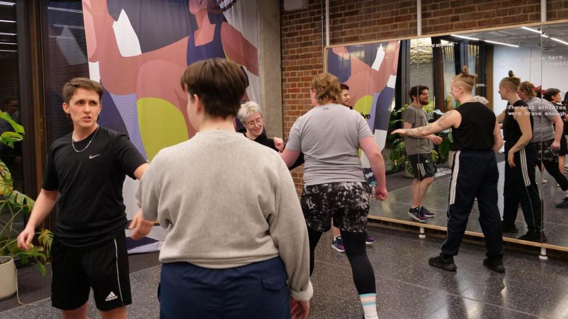 People take part in a self-defence class