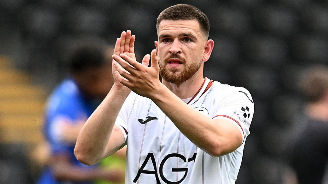Zan Vipotnoik applauds fans after Swansea's defeat by Birmingham last weekend 