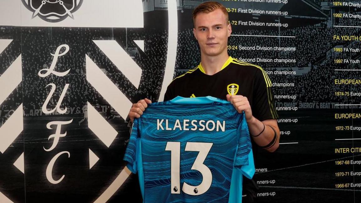 Kristoffer Klaesson holding his Leeds number 13 shirt