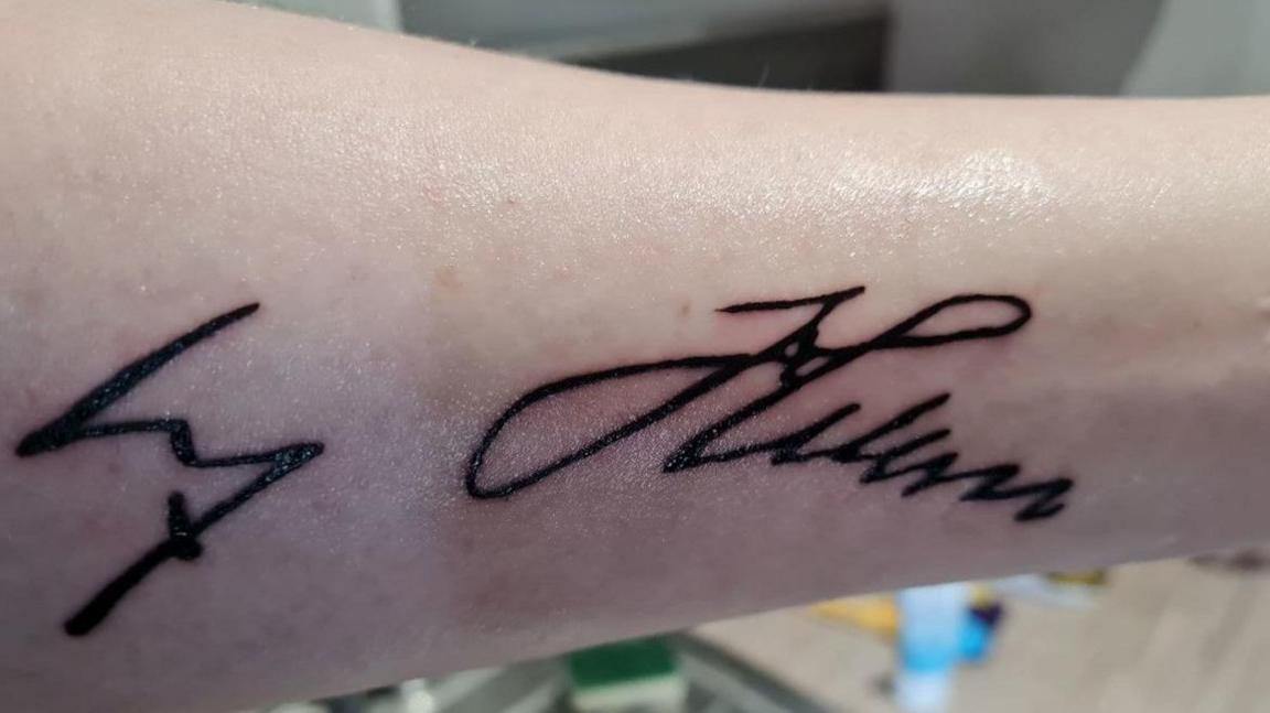 Tattoo of Adolf Hitler's signature on the left forearm of Parslow