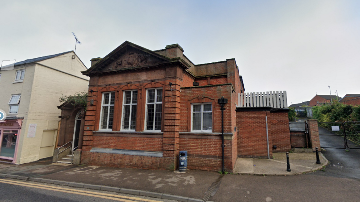 A single-storey Victorian red brick-built former bank