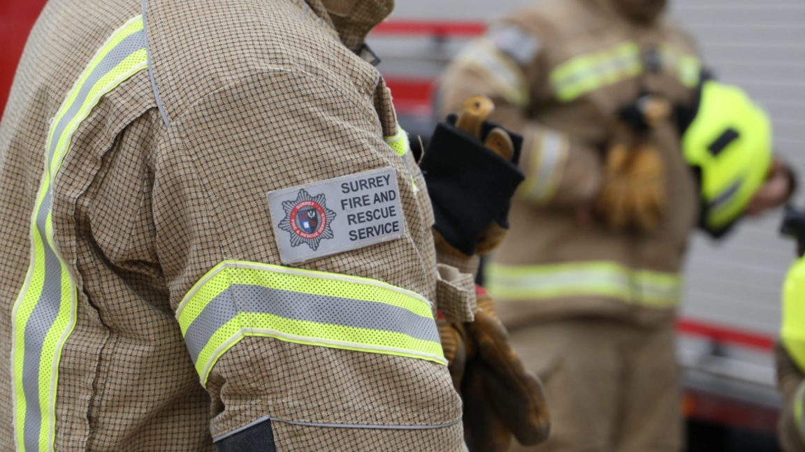 A Surrey Fire and Rescue Service firefighter in protective gear