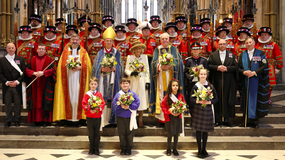 The Queen posing with other people at the Maundy service.