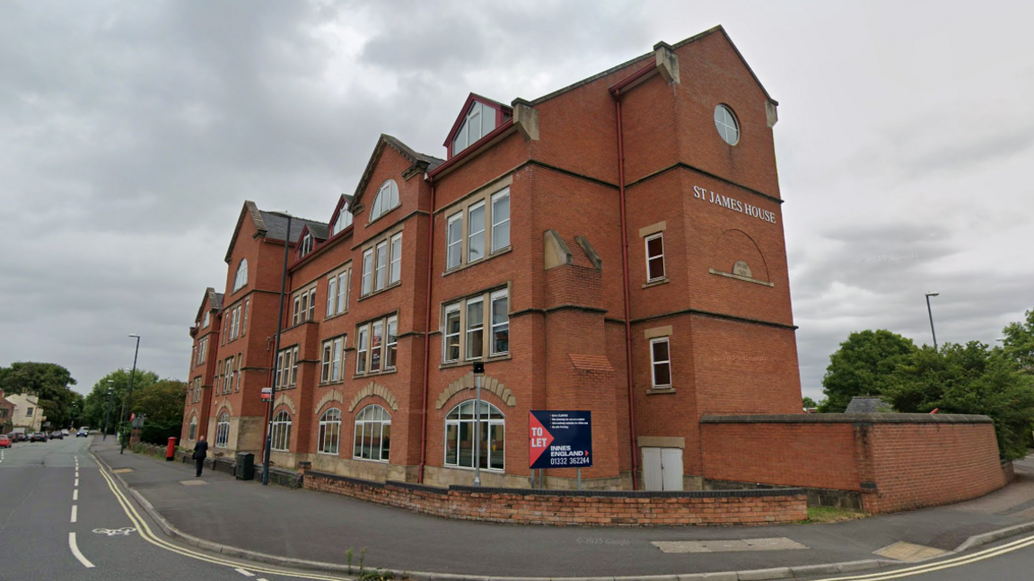 A large four-storey red brick building
