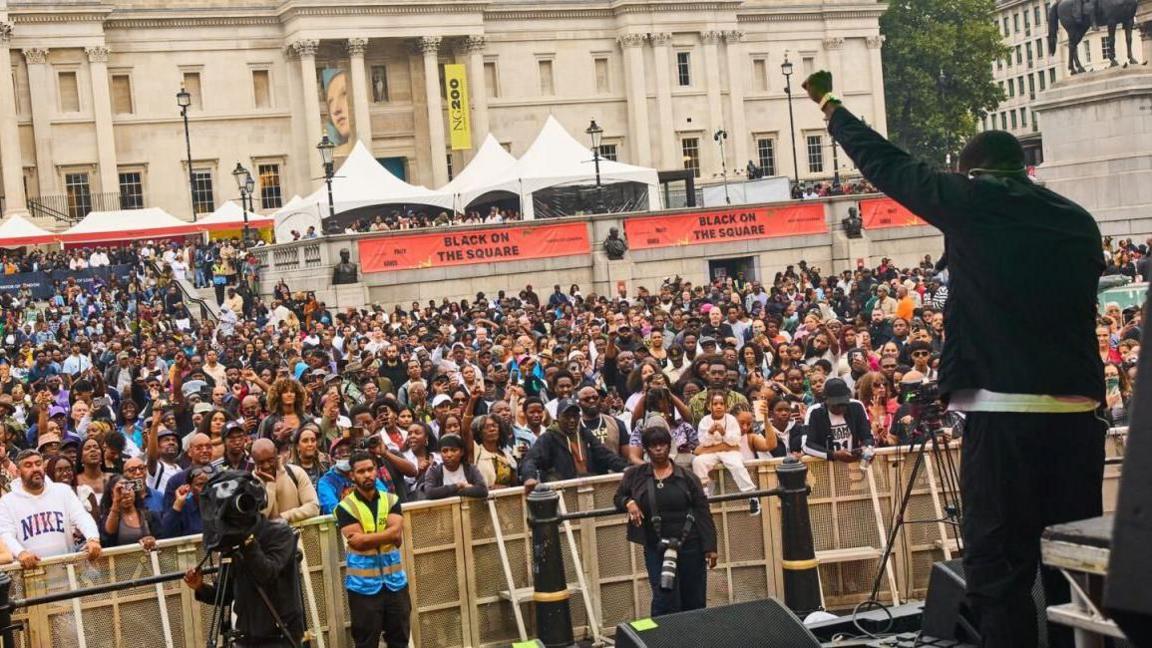 picture from the stage of a performer from previous a year of Black On The Square 