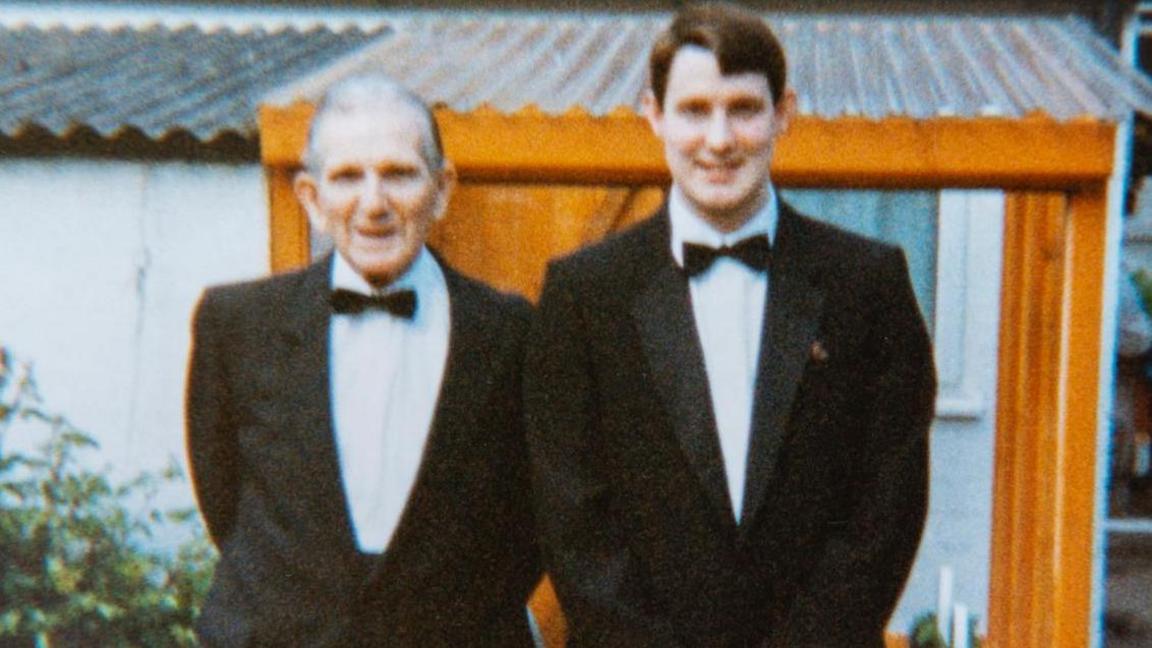 Ted Peterson MBE and grandson, Hywel Peterson MBE pictured in dinner jackets and black tie in 1996 going to a Welsh Sports Hall of Fame event where Ted was named 'unsung hero of sport'