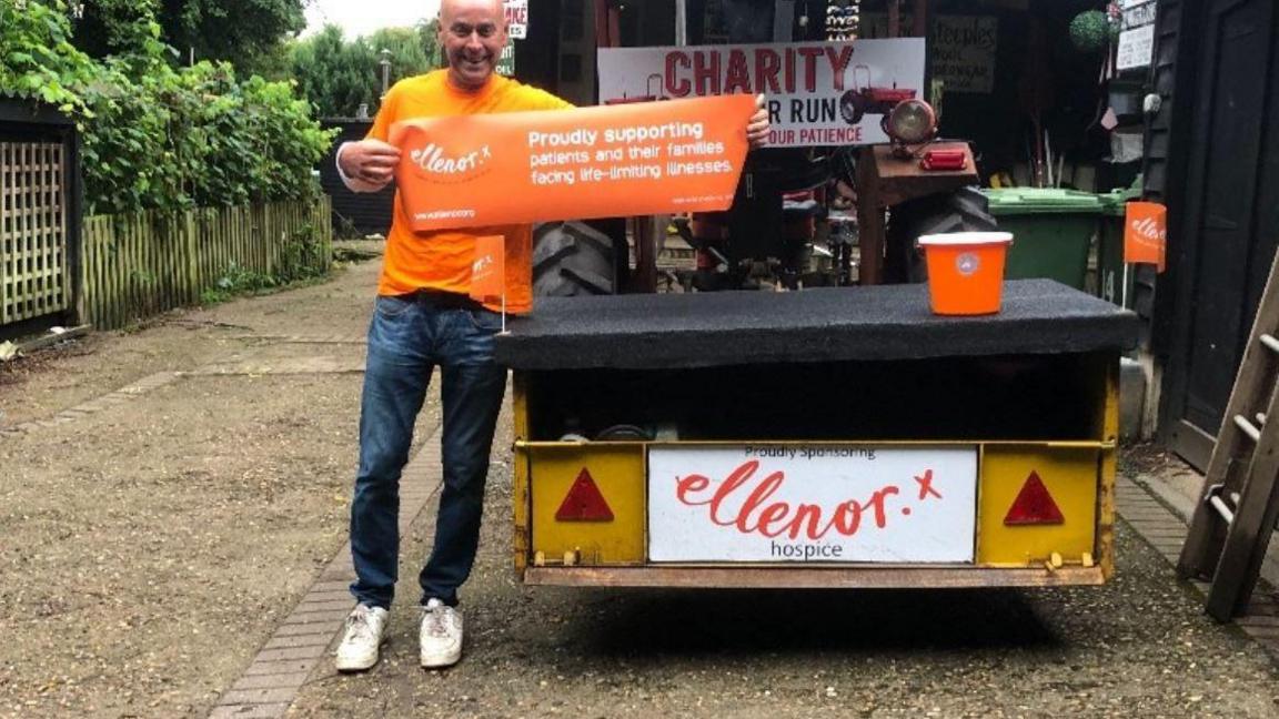 Danny Chamberlain with Ellenor banner