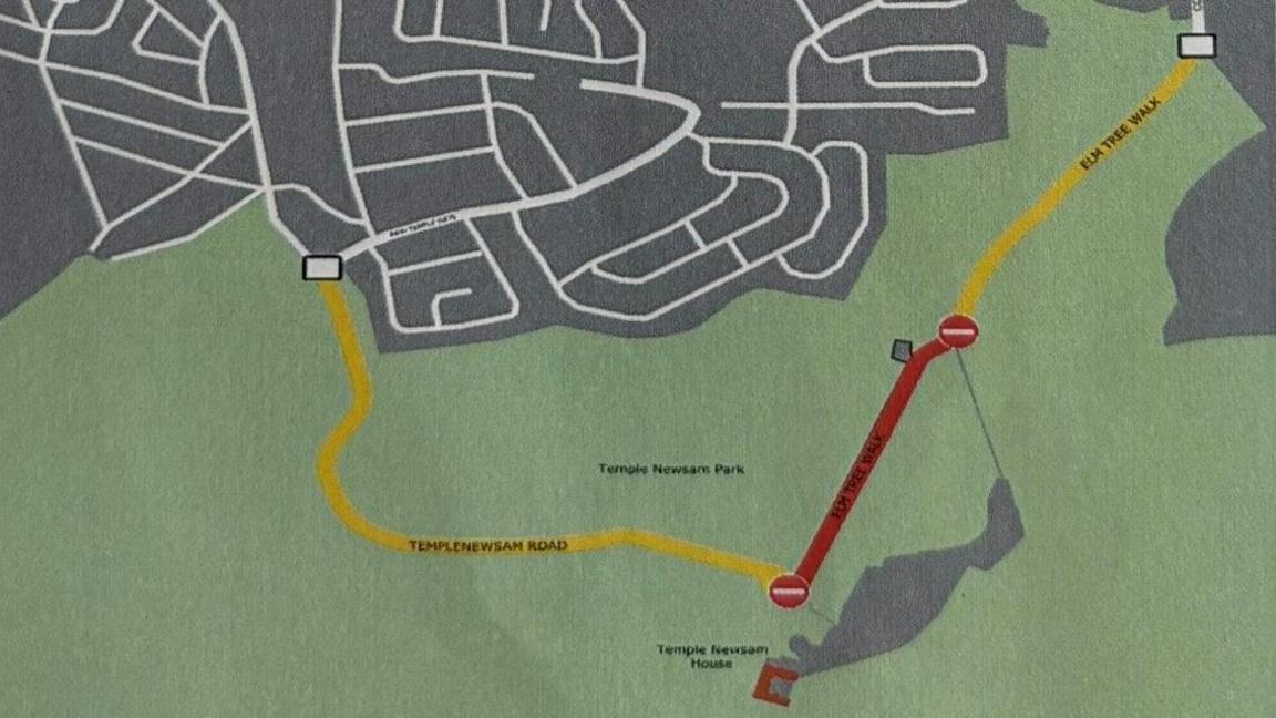 A map indicating two roads in large green space marked in yellow and a third marked in red. Roads indicating a more urban estate can be seen at the top of the map.