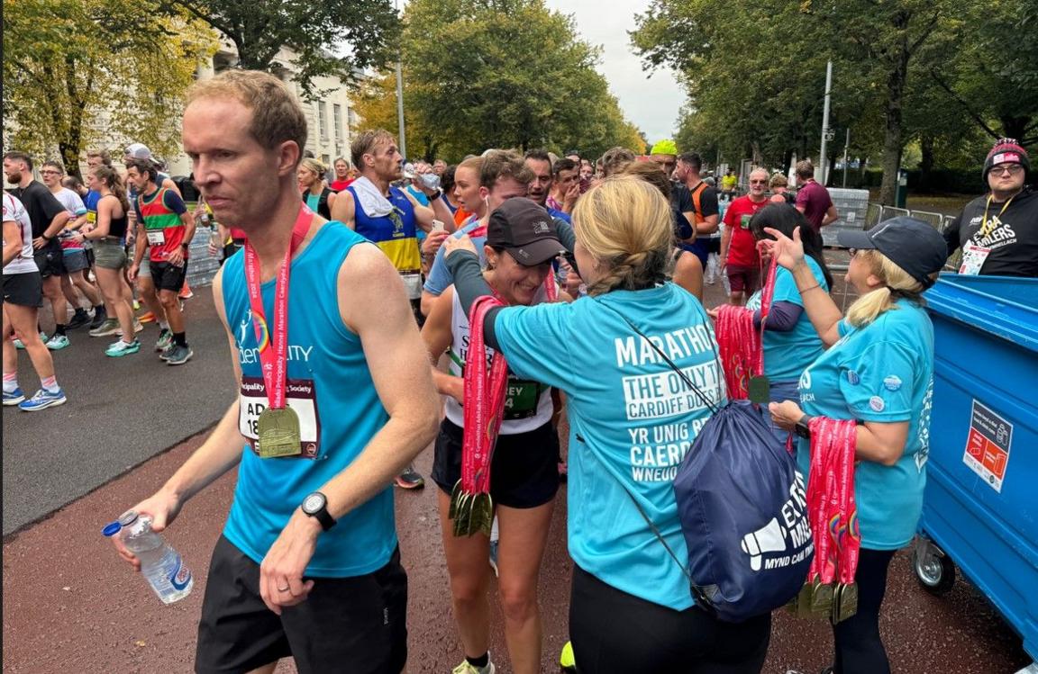 Participants have their medals put around their necks