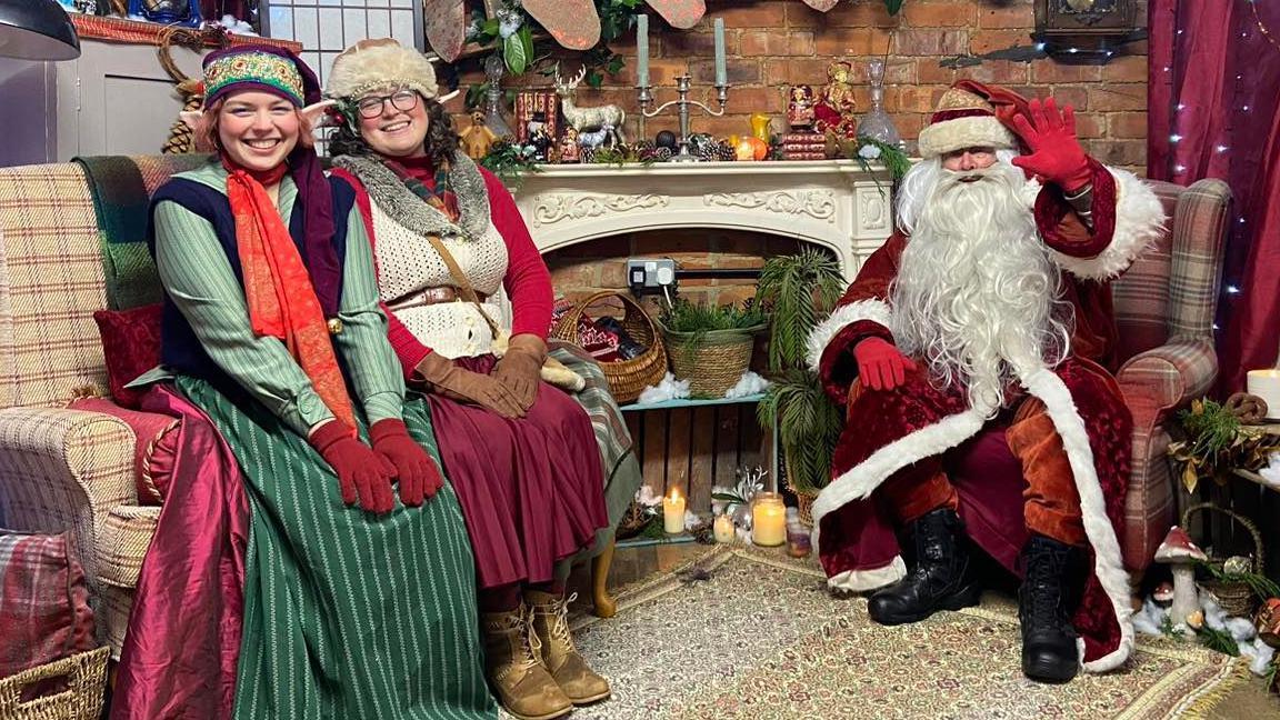 A Santa's grotto with two helpers in Northampton 