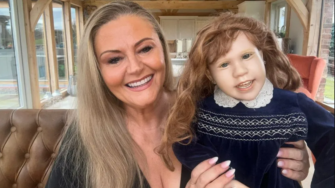 Deborah Davies with the doll