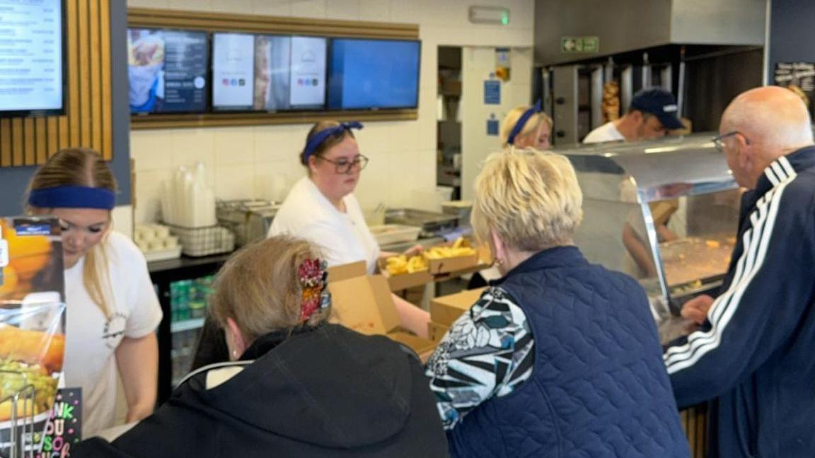 A fish and chip shop counter