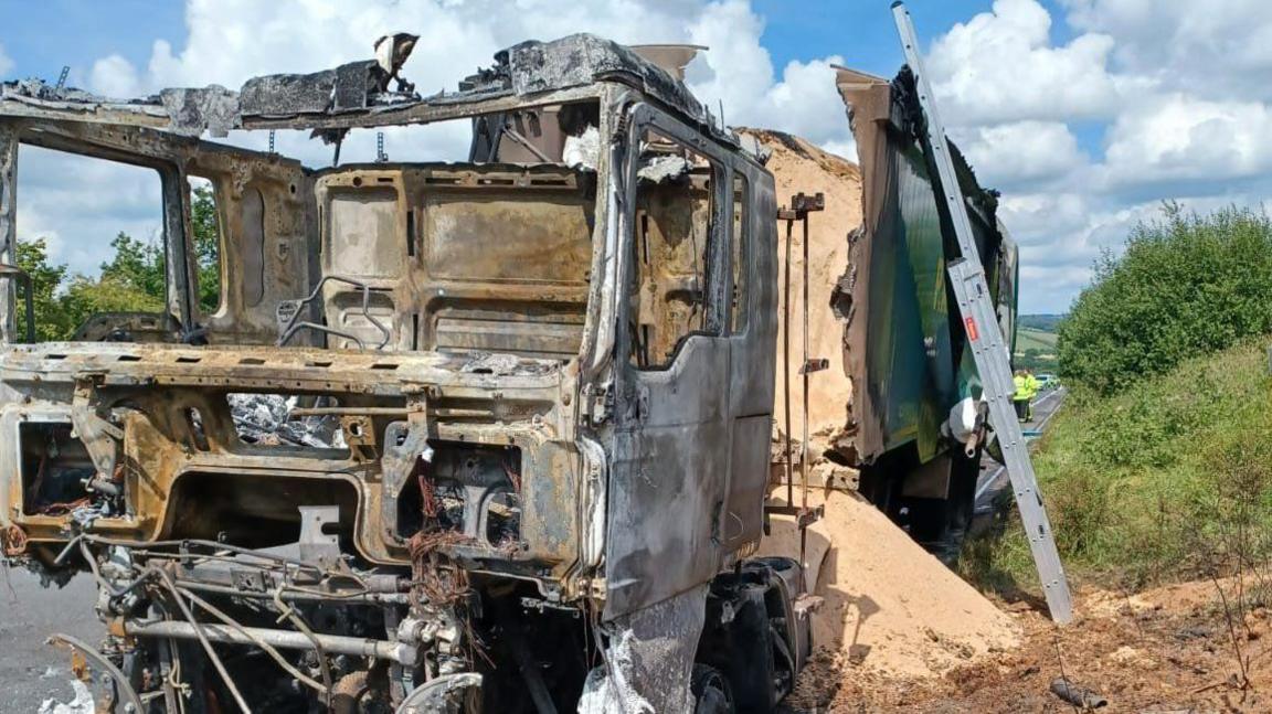 Burnt out lorry on A30