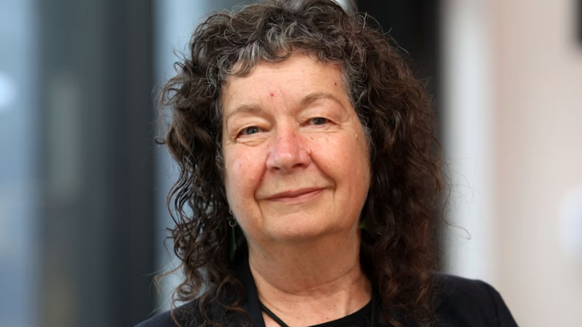 Picture of Vice Chancellor Wendy Larner. She has dark brown hair with silver streaks and smiles at the camera.