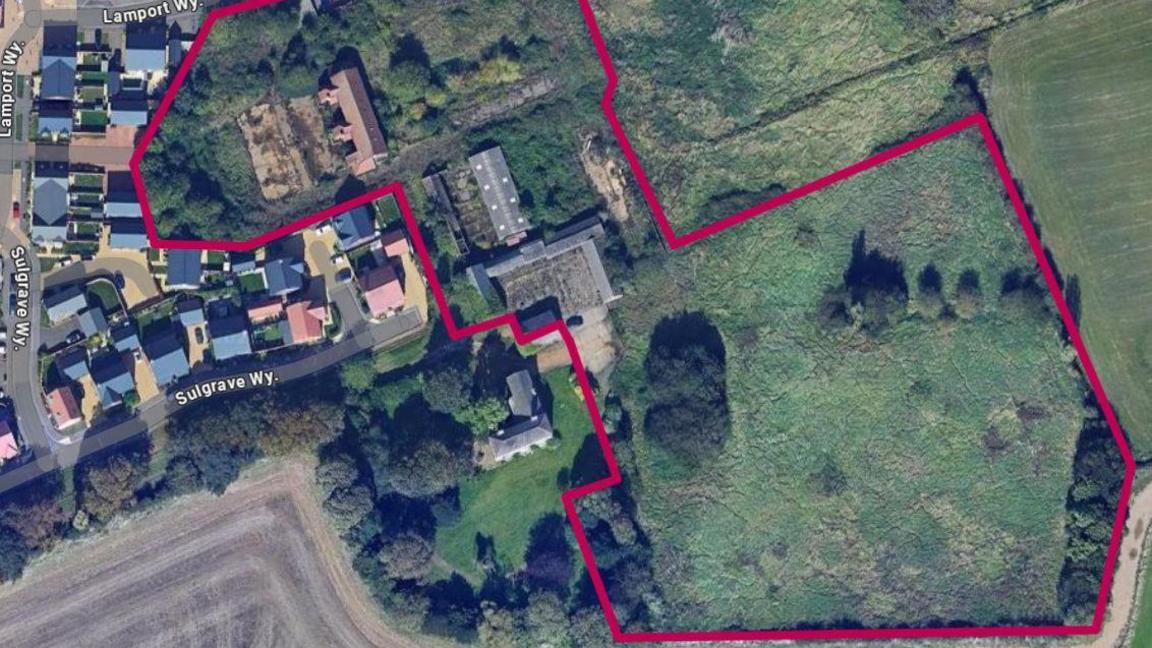 A birds-eye view of the site proposed for the development of 60 homes. Green space is circled in red to highlight where the new project would be located.