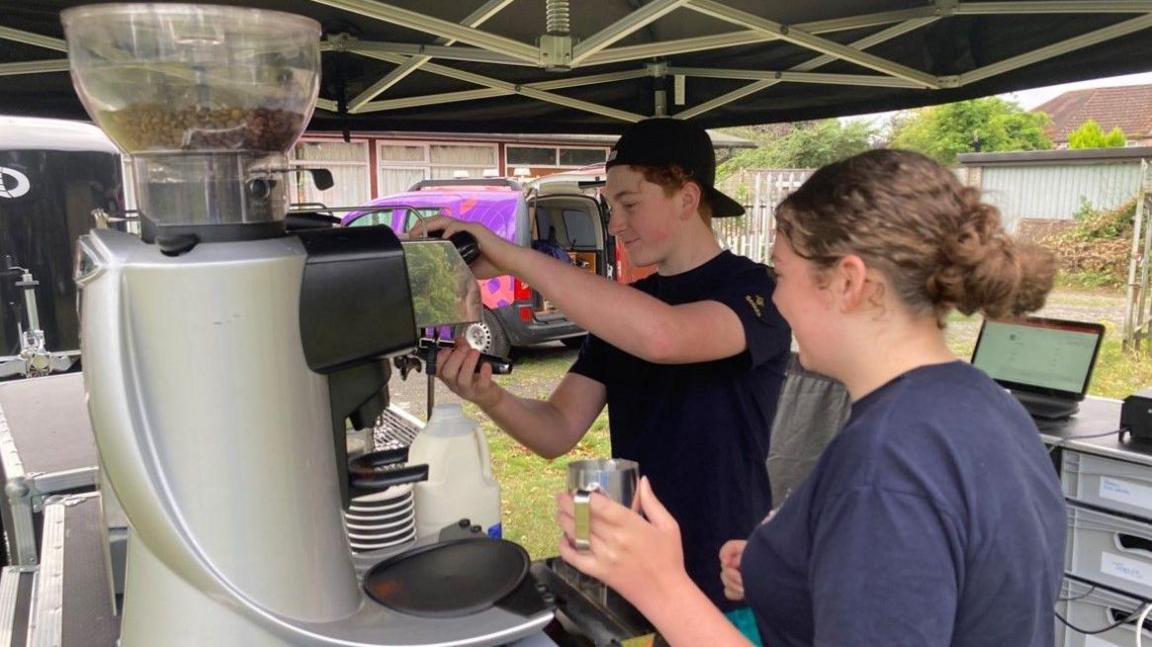 Mobile coffee facility, with people serving