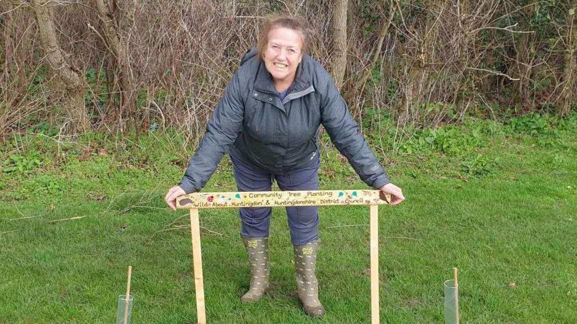 Steph James standing by the community trees in Sapley Park