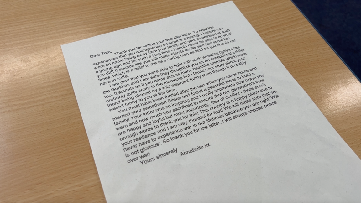 Annabelle's letter laid out on a light brown table