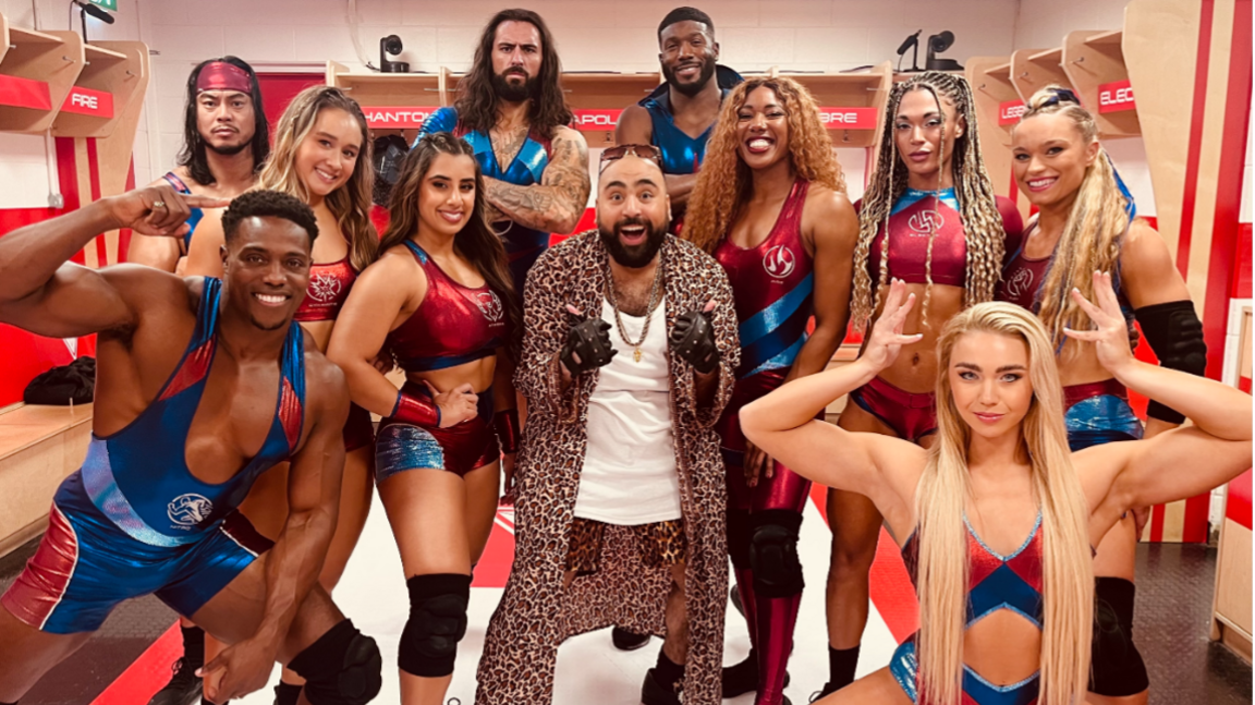 Chabuddy G stands in the middle of the Gladiators in the changing rooms.