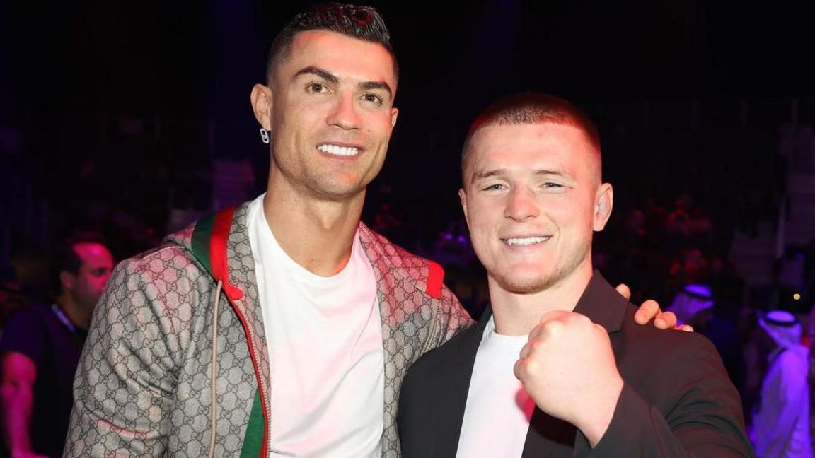 Paul Hughes is congratulated by Cristiano Ronaldo following his victory in Riyadh on Saturday night