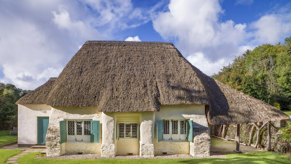 General view of the Friends Meeting House from the south, showing its wheat reed thatched roof