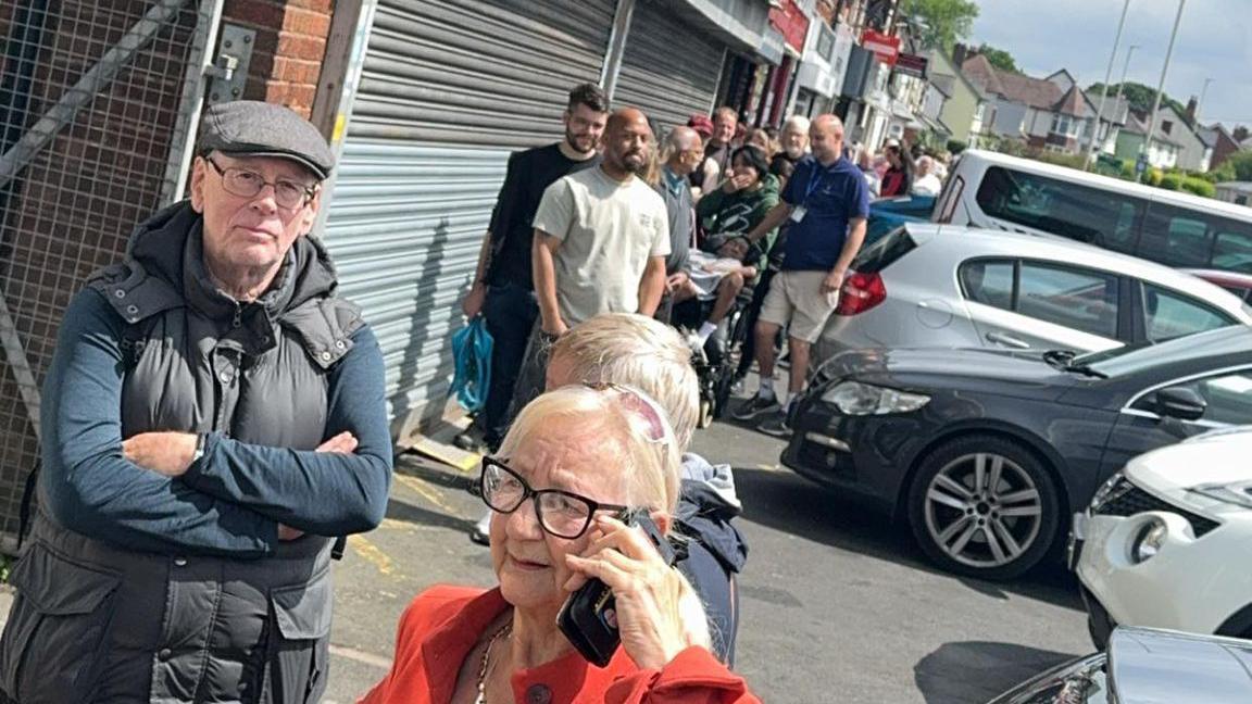 People queuing outside a chippy