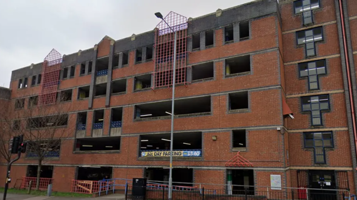 A red brick building that is five storeys high