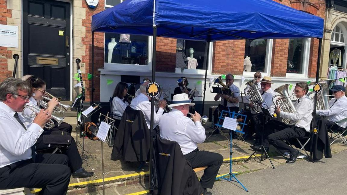 A band playing in the street