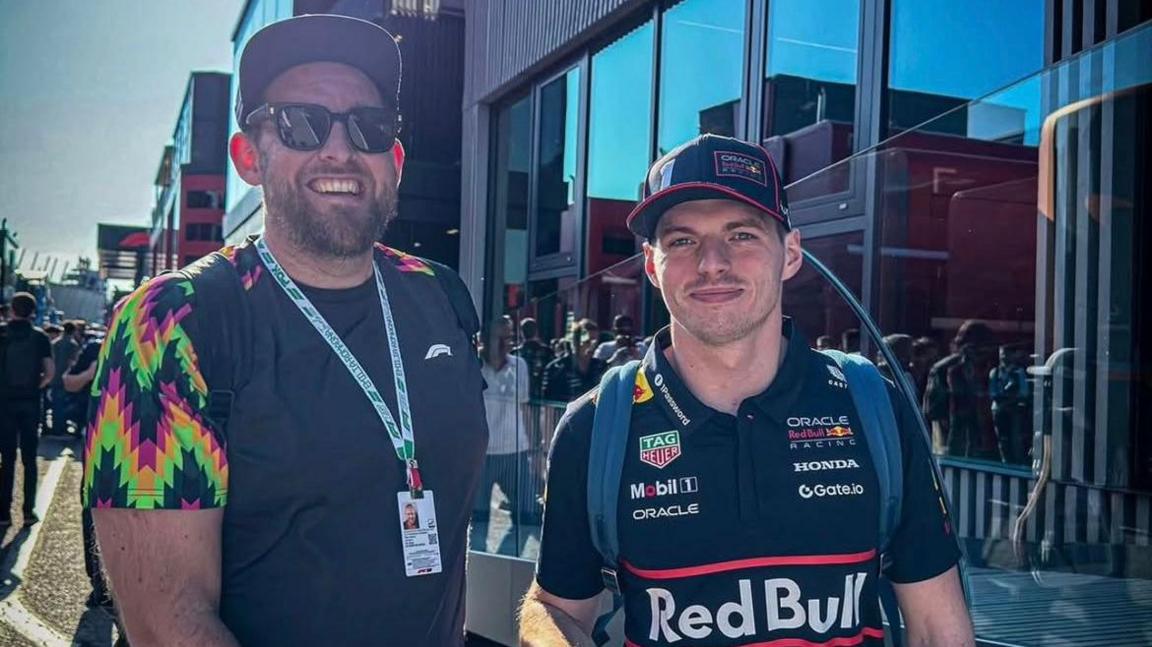 DJ Admin poses for a photograph with Max Verstappen