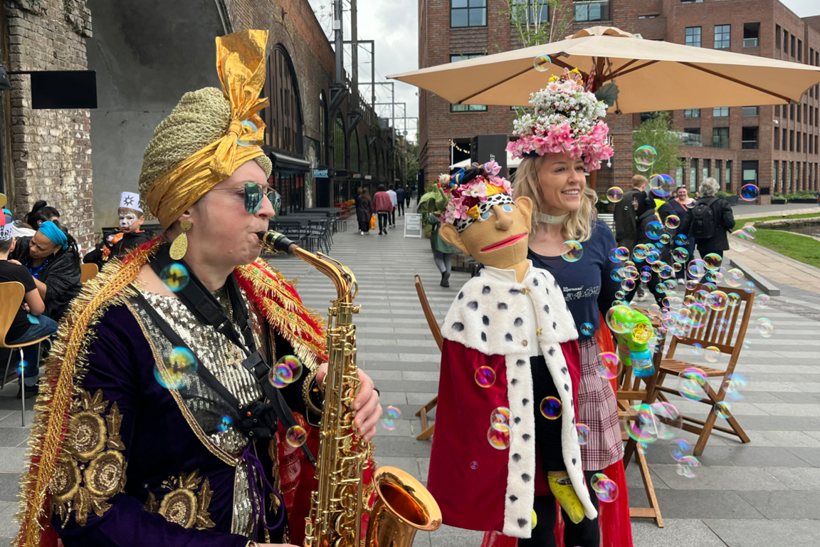 A saxophonist plays in Hawley Wharf.