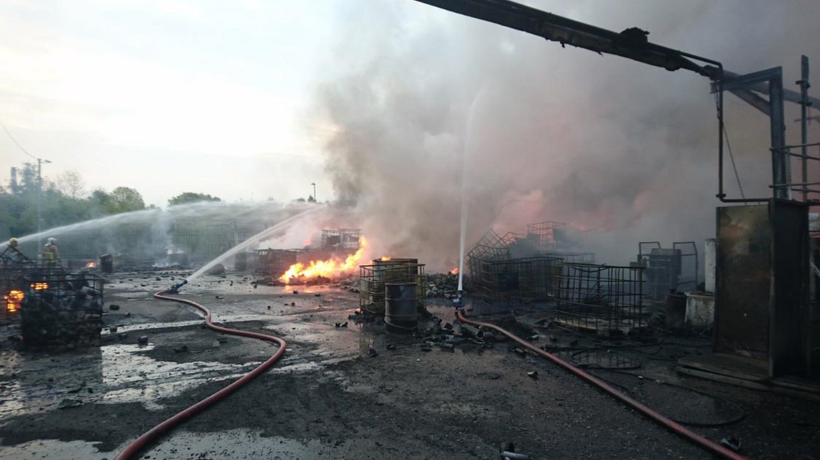 Fire crews tackle blaze at Kirkby oil processing plant.