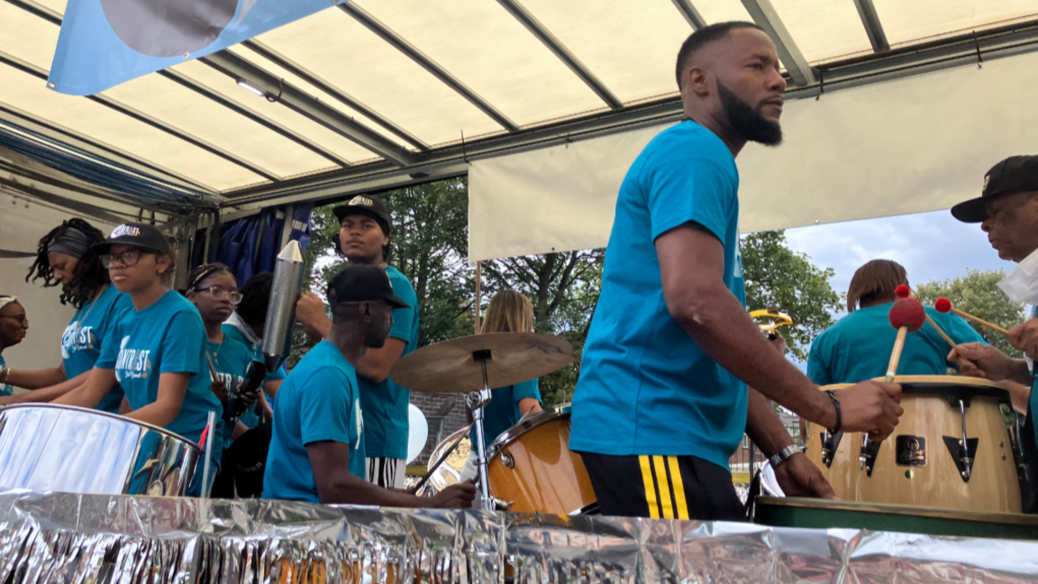 A steel band joined floats for the procession to celebrate Leicester's 40th Caribbean Carnival in 2025.