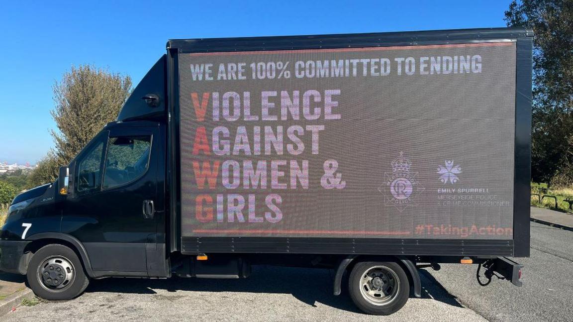 Merseyside Police advert van with text reading: "We are 100% committed toe ending violence against women and girls" #TakingAction