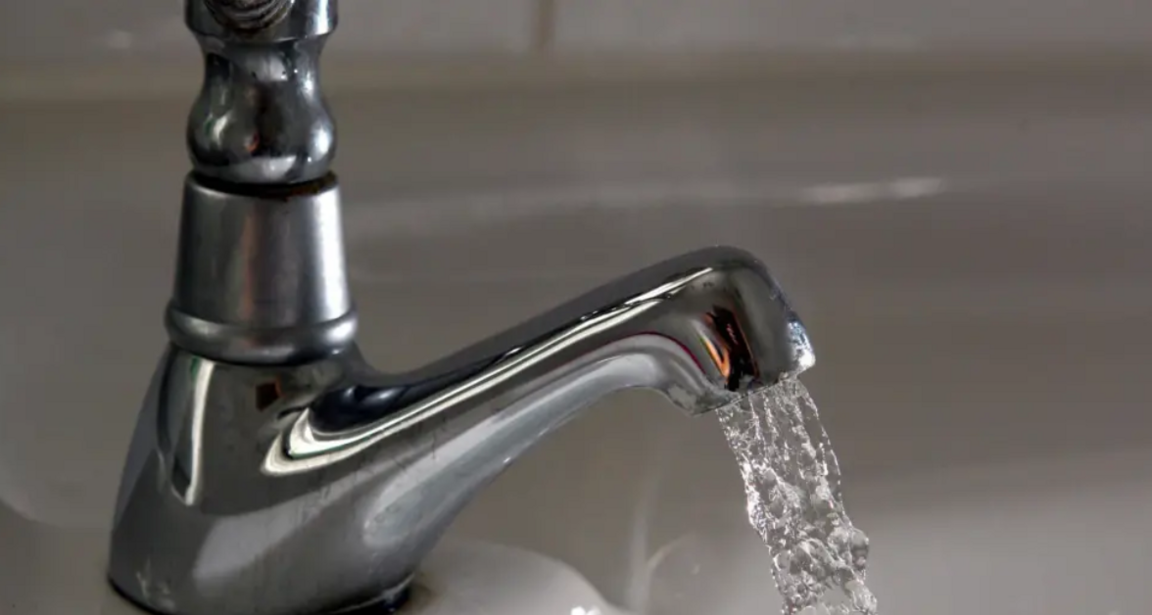 A stock image of a tap with water coming out.