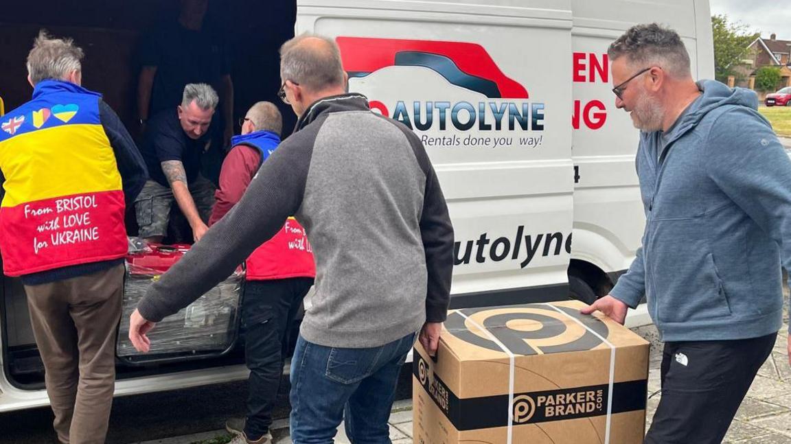 Men loading boxes into a truck