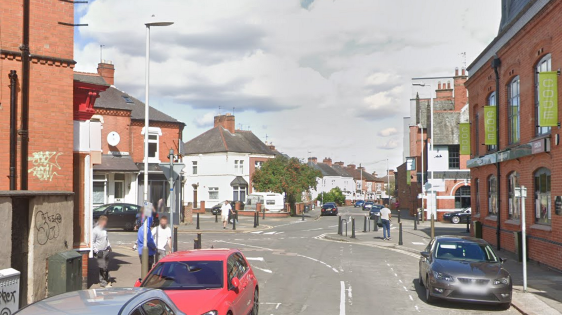 The cluttered approach to a staggered junction along a residential city street