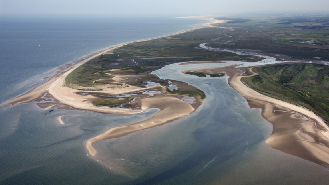 The Brancaster coastline seen from above, with the SS Vina shipwreck three tiny specks in the sea