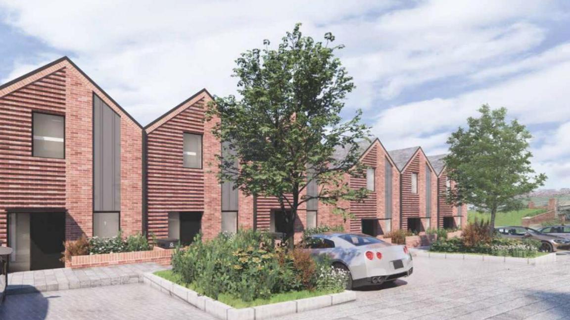 Illustrative designs of what the townhouses proposed on-site could look like. A row of similar homes can be seen made from red bricks. Car parking spaces can be seen outside along with trees and vegetation.