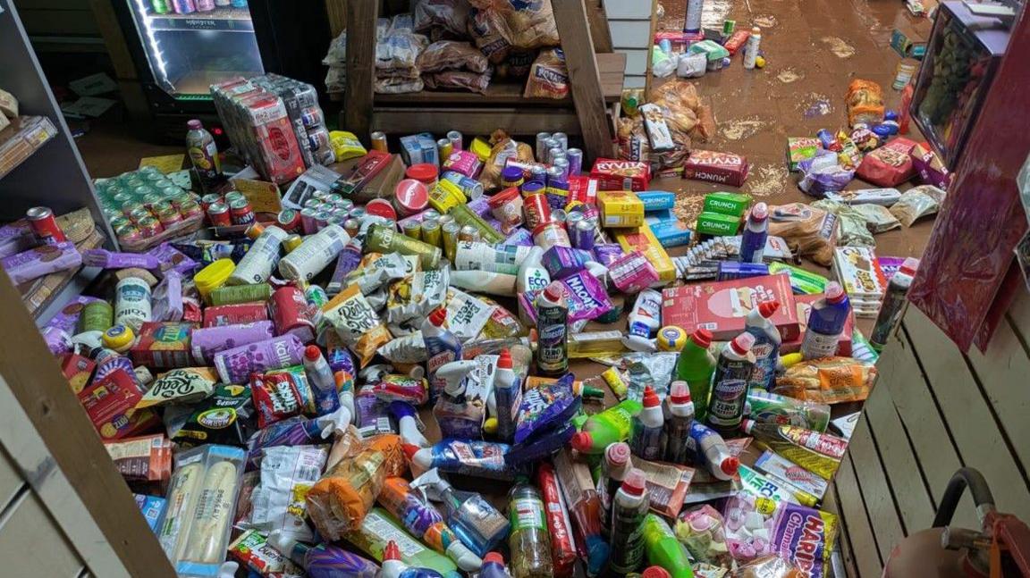 Items of various colours cover much of the floor in this image.