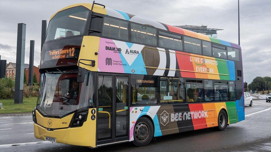 This Bee Network bus has been wrapped with rainbow Pride colours with wording including 'Love connects everyone' along with 'Bee Network' and 'Transport for Greater Manchester' on the side.