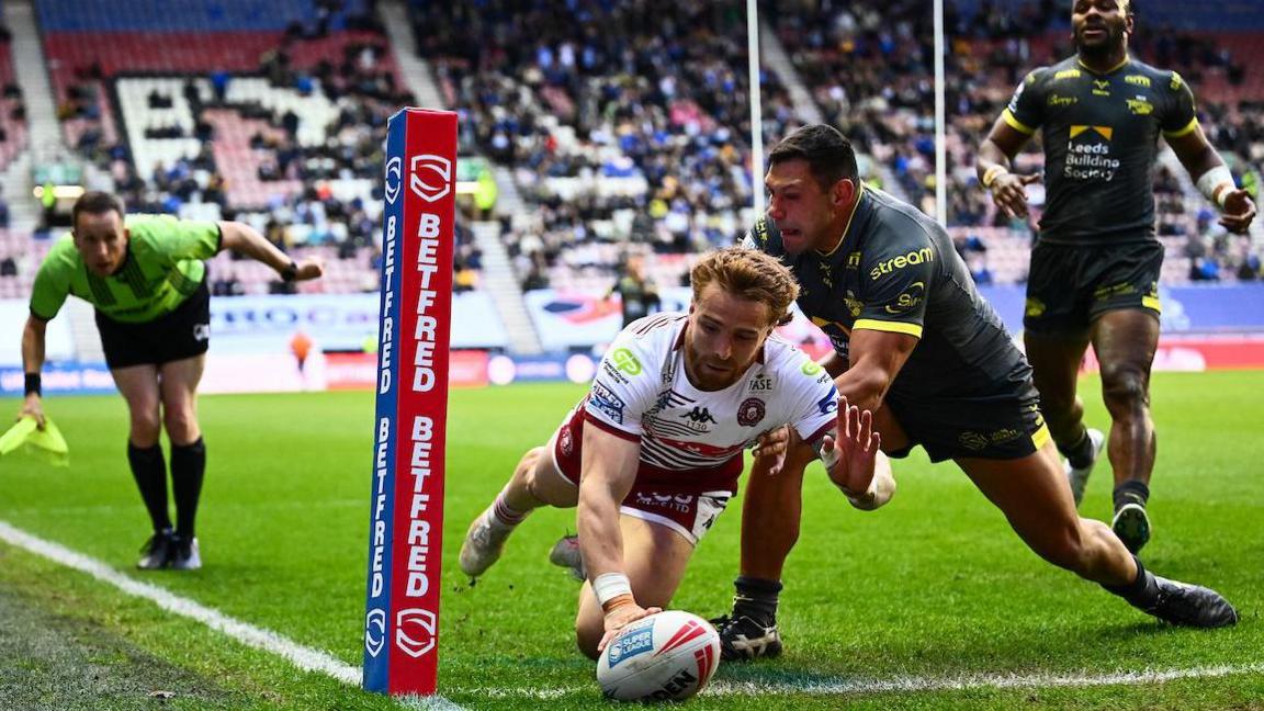 Adam Keighran scores under pressure from Leeds Ryan Hall