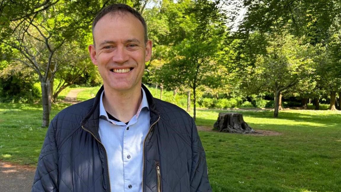 Dr Niek Buurma of Cardiff University standing smiling in a park