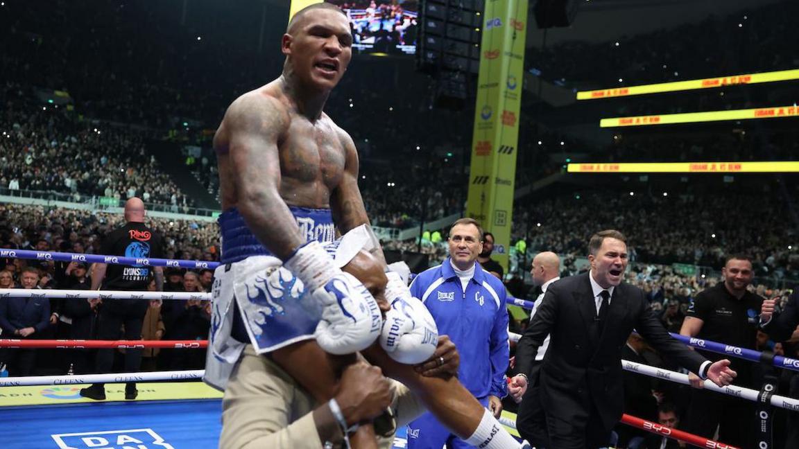Nigel Benn holds Conor Benn on his shoulders