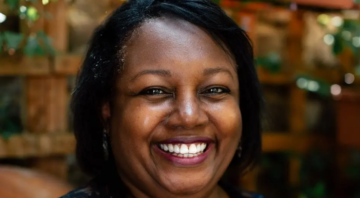 Malorie Blackman smiling and looking directly at the camera