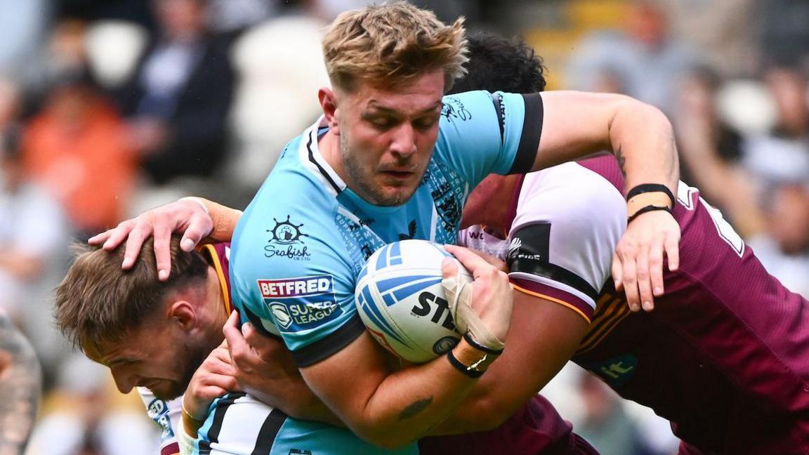 Hull FC forward Will Kirby carries the ball into contact against Huddersfield Giants